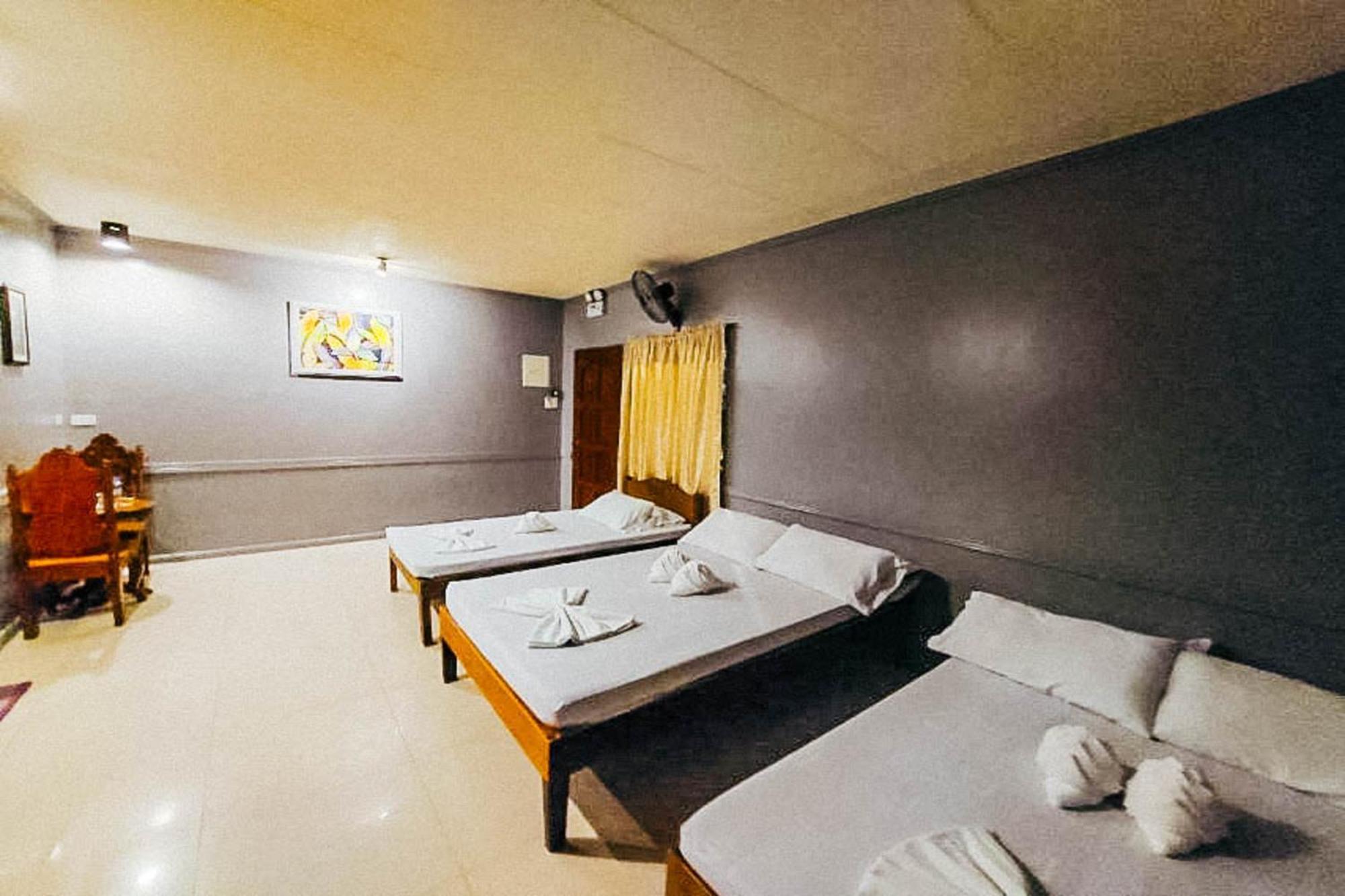 Mbg Travellers Inn Powered By Cocotel Puerto Princesa Bilik gambar
