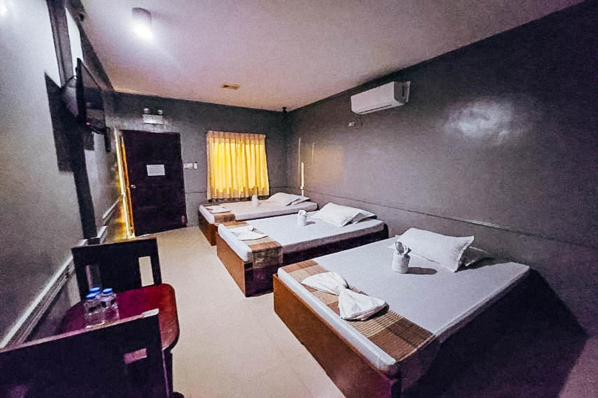 Mbg Travellers Inn Powered By Cocotel Puerto Princesa Bilik gambar