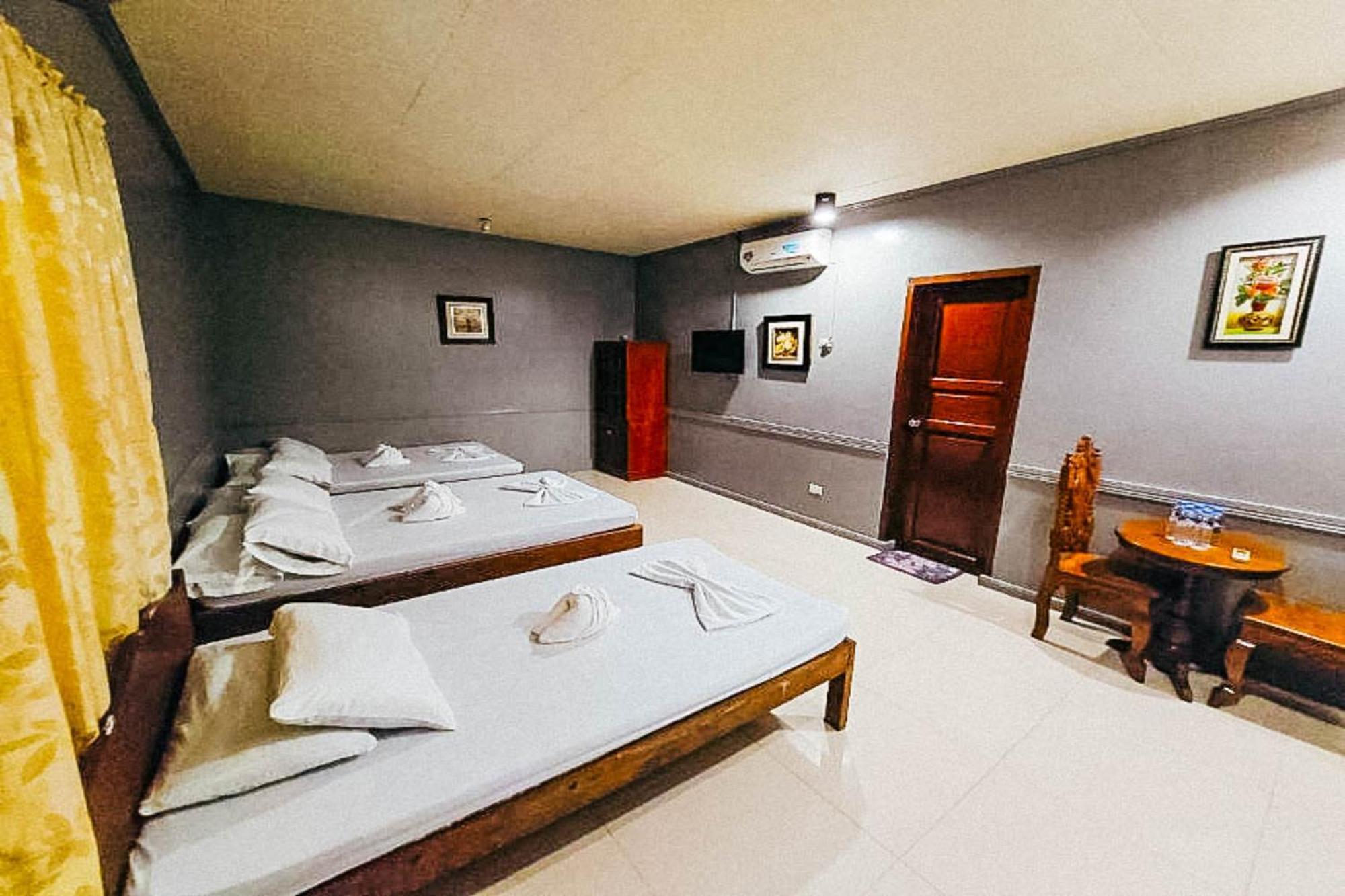 Mbg Travellers Inn Powered By Cocotel Puerto Princesa Bilik gambar
