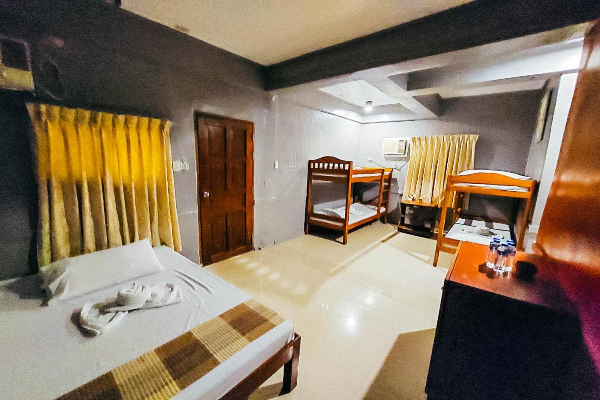 Mbg Travellers Inn Powered By Cocotel Puerto Princesa Bilik gambar