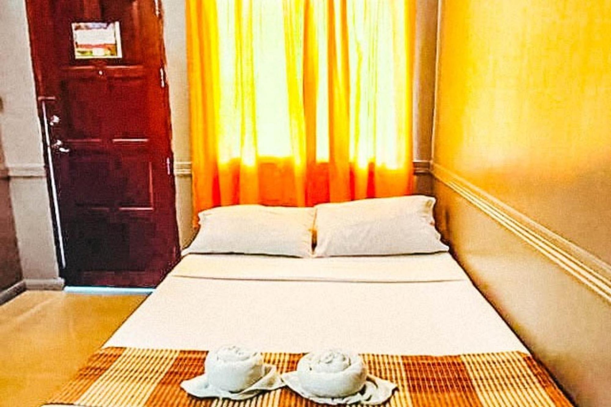 Mbg Travellers Inn Powered By Cocotel Puerto Princesa Bilik gambar