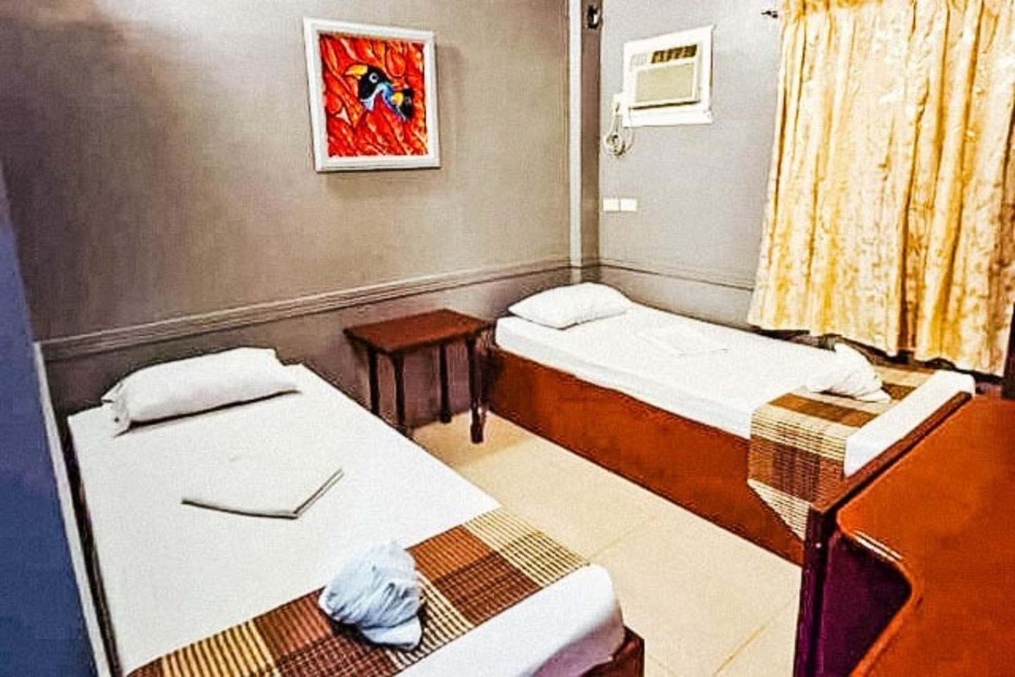 Mbg Travellers Inn Powered By Cocotel Puerto Princesa Bilik gambar