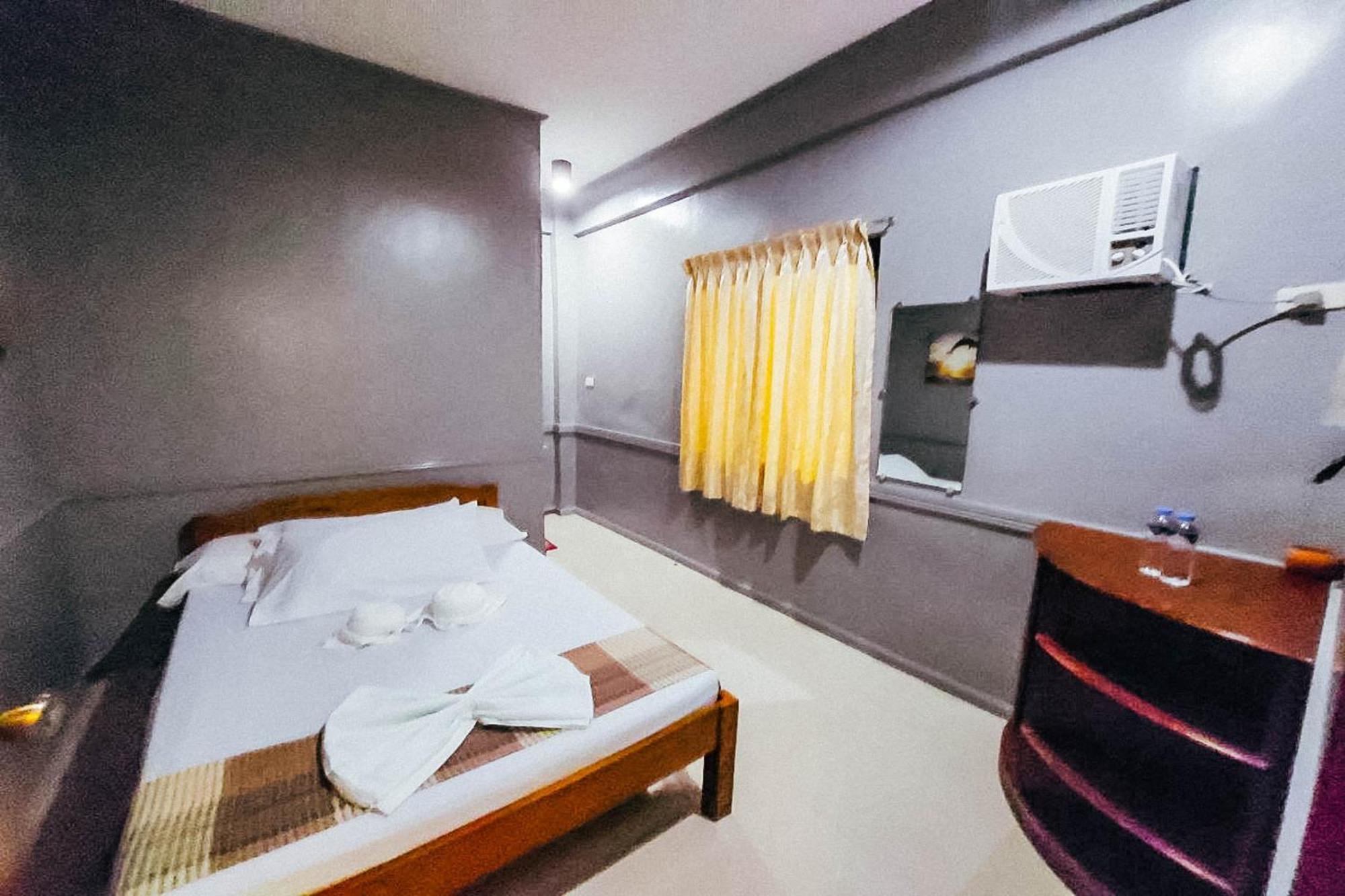 Mbg Travellers Inn Powered By Cocotel Puerto Princesa Bilik gambar