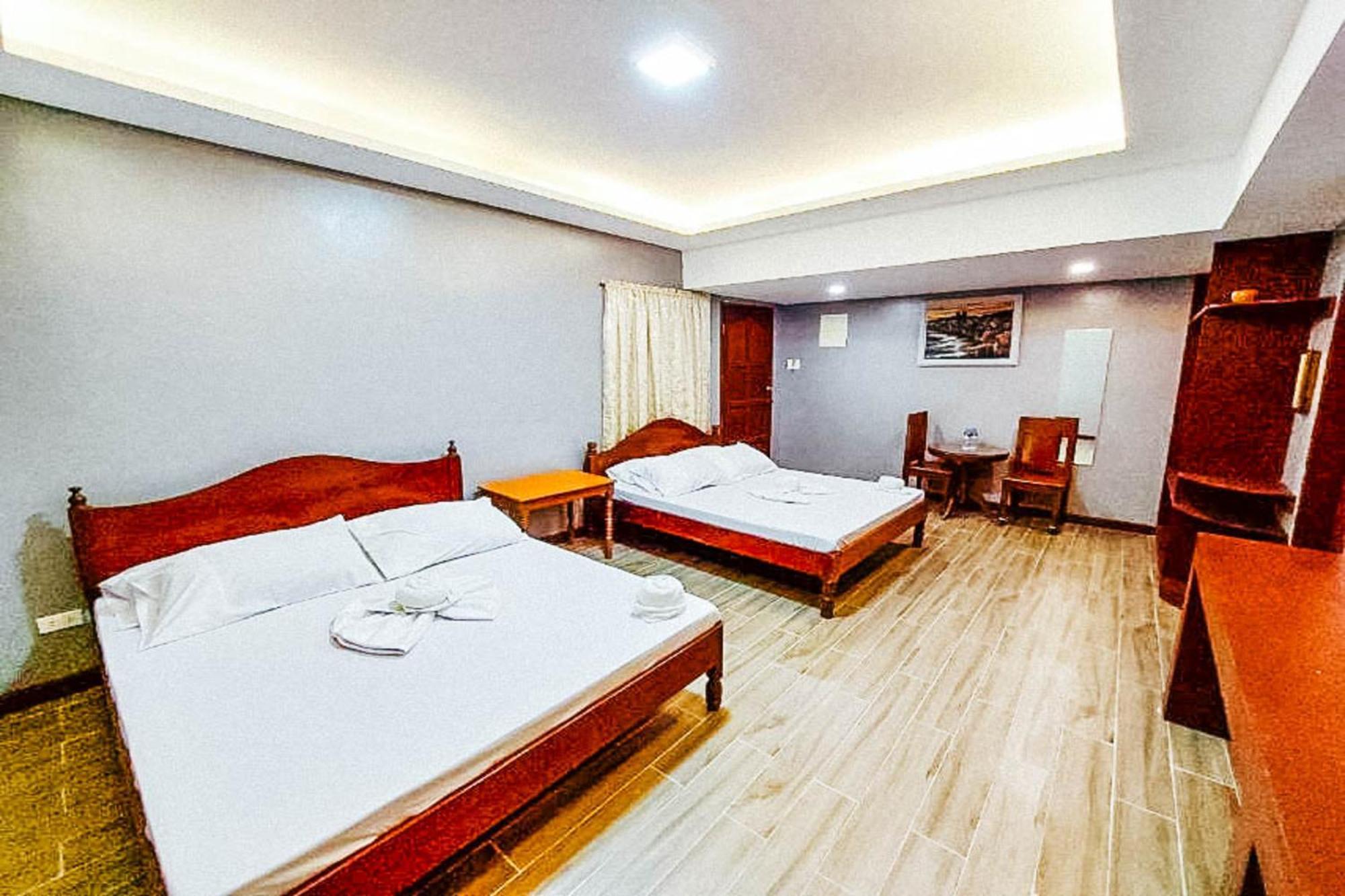 Mbg Travellers Inn Powered By Cocotel Puerto Princesa Bilik gambar